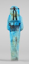 Amenhotep's shabti with baskets on the back; arms crossed on the chest, right folded over left,