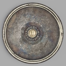 Platter with a gold medallion of Theodosius II. Flat silver platter on a ring-shaped foot with
