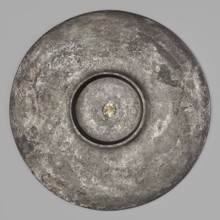 Platter with a gold medallion of Theodosius II. Flat silver platter on a ring-shaped foot with