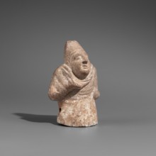 Hunchback puppet, Figurine hollow inside. Hunchbacked torso with a large head wearing a pointed cap