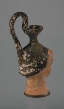 Oinochoe in the shape of a woman's head, repossession Bytom. Greece. Oinochoe, head iconography,