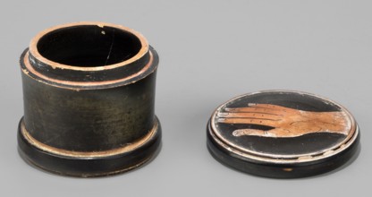 Red-figure pyxis with an image of a hand on the lid. Small pyxis with a lid. Cylindrical shape,