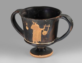 Red-figure kantharos with a depiction of an ephebe with an aryballos and a Greek inscription