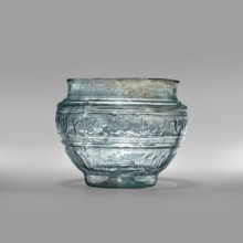 Bowl with Greek inscription. Glass bowl made of transparent, light blue glass with a Greek