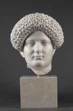 Portrait of a Roman woman, Head with a broad face and an elaborate hairstyle: hair twisted into