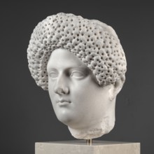 Portrait of a Roman woman, Head with a broad, round, full face and a triangular forehead; elaborate