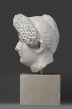 Portrait of a Roman woman, Head with a broad face and an elaborate hairstyle: hair twisted into