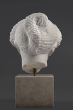 Portrait of a Roman woman, Head with a broad face and an elaborate hairstyle: hair twisted into