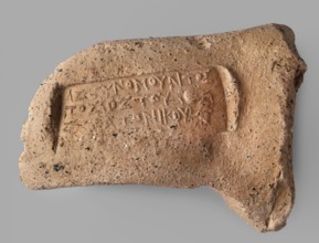 Fragment of a stamp from a Sinopean transport amphora with the stamp of the astynomeus Posis, son