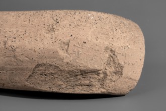 Fragment of a Sinopean amphora vice with a partially preserved rectangular stamp. The stamp is oval