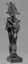 Figurine of the god Osiris, Osiris mythology; statuette of a standing Osiris wrapped in a long,