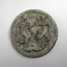 Mirror cover with an image of a couple. The bronze cover is decorated with a figurative scene of