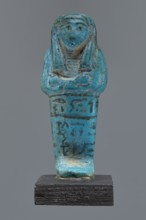 Ushabti Cha-em-uase. A mummy-shaped figurine shabti made of faience and pressed into a mold.
