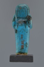 Ushabti Cha-em-uase, Cha-em-uase private name. A mummy-shaped figurine shabti made of faience,