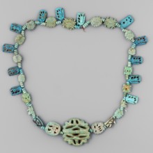 Necklace of 33 amulets and plaques, separated by tiny spherical beads several, usually 3 in a row,
