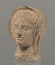 Votive head, Head of a young man covered with a shawl, from under which hair emerges in the form of