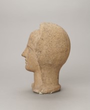Votive head, Head of a young man covered with a shawl, from under which hair emerges in the form of