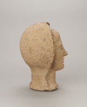 Votive head, head of a young man covered with a shawl, from under which hair emerges in a fringe