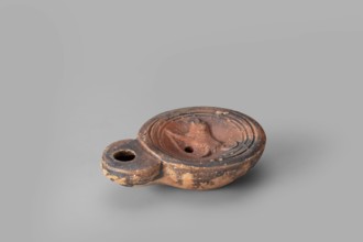 Lamp decorated with a depiction of a dog, unknown eastern workshop; single-burner oil lamp; dogs