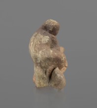 Terracotta figurine of Silenus, Silenus mythology, terracotta. Figurine of an obese Silenus sitting