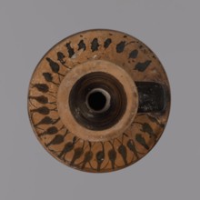 Black-figure lekythos, unknown Attic workshop. Yellowish clay, matte firnia. Disc-shaped foot,