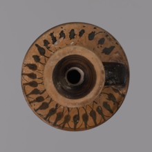 Black-figure lekythos, unknown Attic workshop. Yellowish clay, matte firnia. Disc-shaped foot,