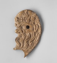 Decoration in the shape of the head of Silenus. Relief appliqué of the head of Silenus depicted in