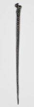 Pin, unknown Luristan workshop. Pin with a thin, oval shaft terminating in a head in the form of a