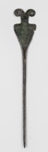 Pin, unknown Luristan workshop. Pin with a thin, oval shaft transitioning into a flat head composed
