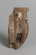 Fragment of a sarcophagus mask. Preserved half of a face made from a single piece of wood. Above