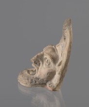 Tragic mask, terracotta, 4th–3rd century BC, Southern Italy. Tragic mask depicting a male face,