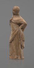 Terracotta figurine of a veiled woman, Dancers, molded female figurine in the Tanagra style,