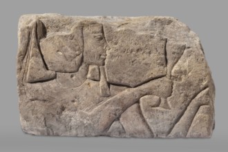 Relief depicting Ramesses II with a ritual vessel, uraeus iconographic, ibes wig iconographic,