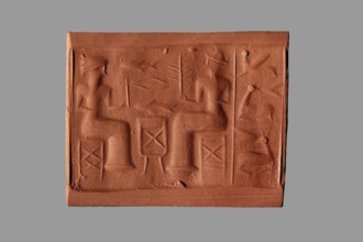 Cylinder seal with a banquet scene, unknown Assyrian workshop. The cylinder's surface is engraved