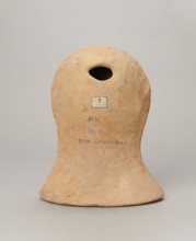 Votive female head, Female head wearing a wreath, from under which lush locks of hair curl down the