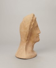 Votive female head, Female head wearing a wreath, from under which lush locks of hair curl down the