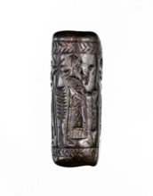 Cylinder seal, unknown Neo-Assyrian workshop. Seal in the so-called linear style with a