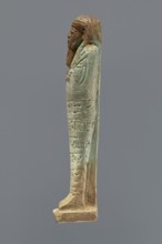 Ushabti, mummy-shaped figurine, funerary gift, hoes. Mummy-shaped figurine standing on a base,
