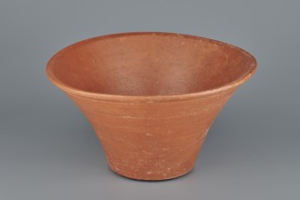 Deep, cup-shaped clay bowl with a slightly convex bottom and sides arching upwards; straight, flat,
