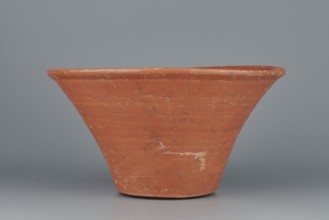 Deep bowl. Deep, cup-shaped bowl with a slightly convex bottom and sides arching upwards; straight,