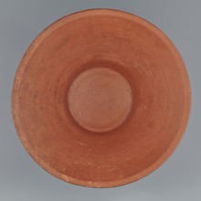 Deep bowl. Cup-shaped clay bowl with slightly convex bottom and sides arching upwards, straight