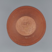 Deep, cup-shaped clay bowl with a slightly convex bottom and sides arching upwards, straight