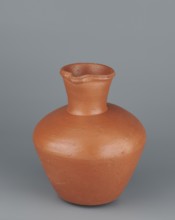 Jug. Medium-sized biconical clay jug with wide, rather sloping shoulders and a wide neck that is