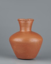 Jug. Medium-sized biconical clay jug, widest at about half its height with wide, sloping shoulders.