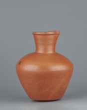 Jug. Medium-sized biconical clay jug with wide, rather sloping shoulders and a wide neck that is