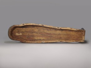 Lid of an anthropoid sarcophagus of a woman. Lid with clearly modeled legs; head sculpturally