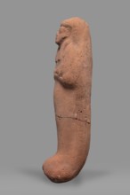 Ushabti. Funerary mummy-shaped figurine, arms crossed on the chest, no tools. On the head is a
