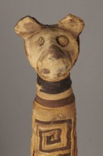 Cat mummy, Cat mummy decorated with a meander made of white and brown bandages. Materials: fabrics,