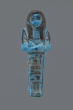 Ushabti Henut-netjeru. Mummy-shaped figurine shabti. Arms crossed on the chest, right folded over