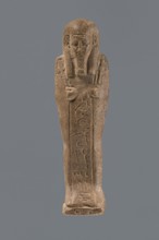 Ushabti, Mummy-shaped figurine, standing on a base with a pilaster at the back. Arms crossed on the